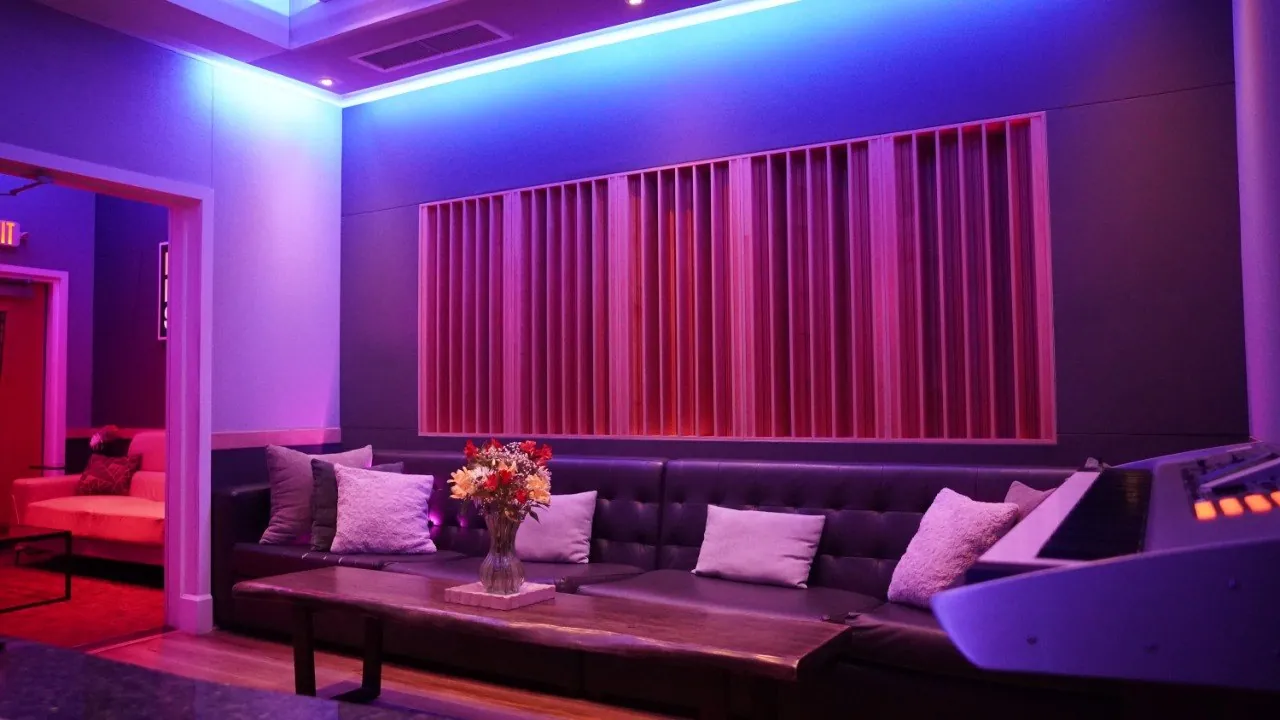 The SSL Room lounge at Bay Eight Studios, seating and acoustic drapes