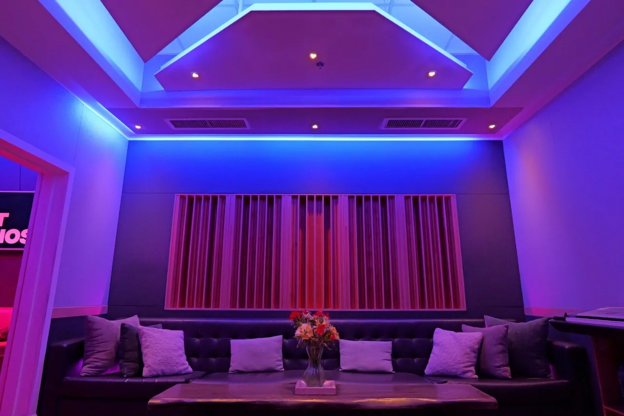 The SSL Room lounge at Bay Eight Studios, seating beneath the LED ceiling
