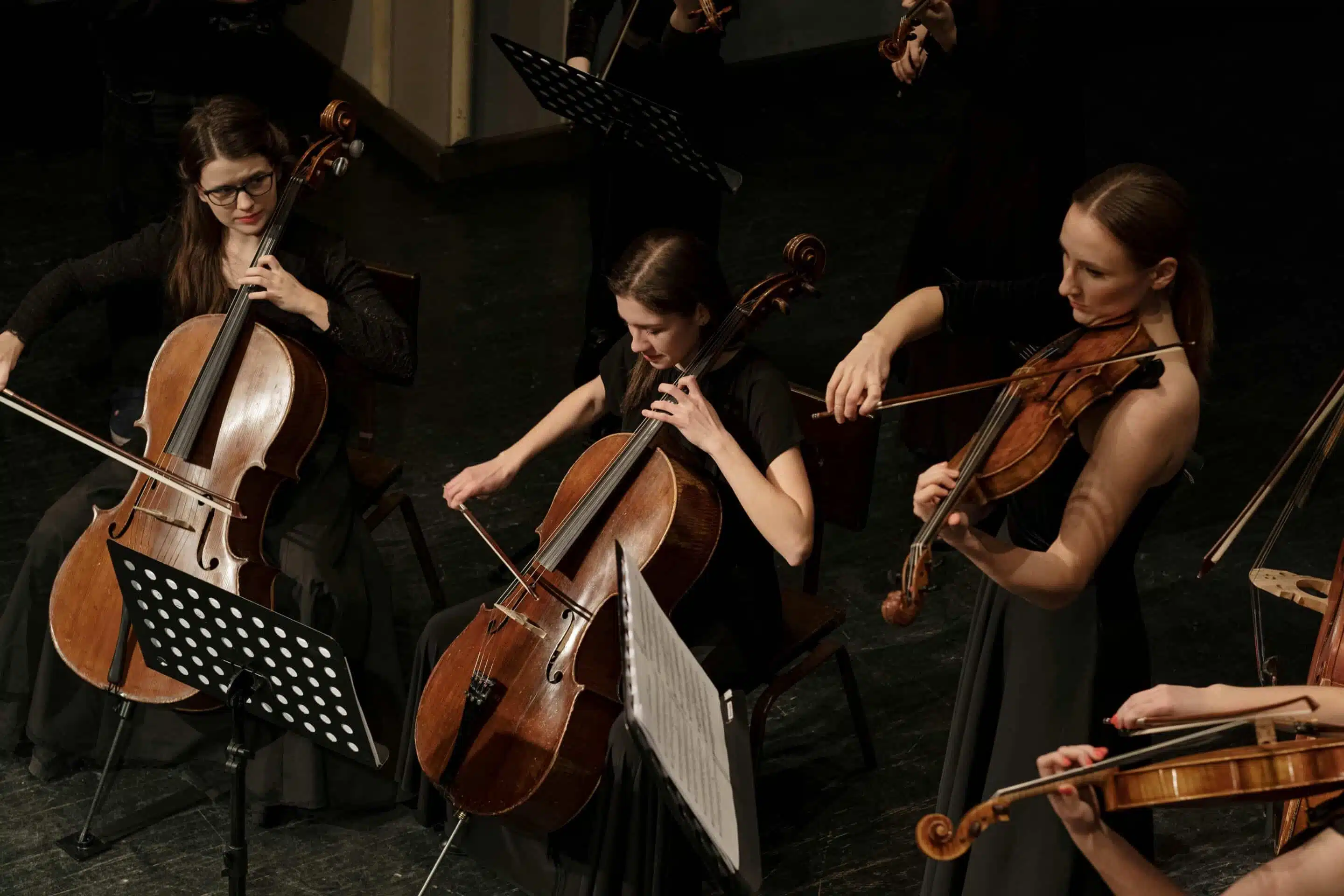 female orchestra playing music 