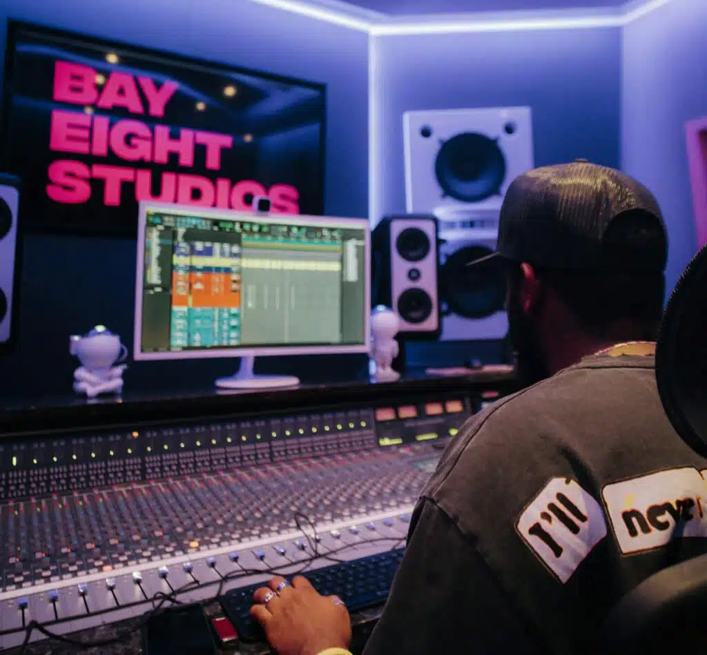 producer in front of board at Miami music and audiobook recording studio Bay Eight